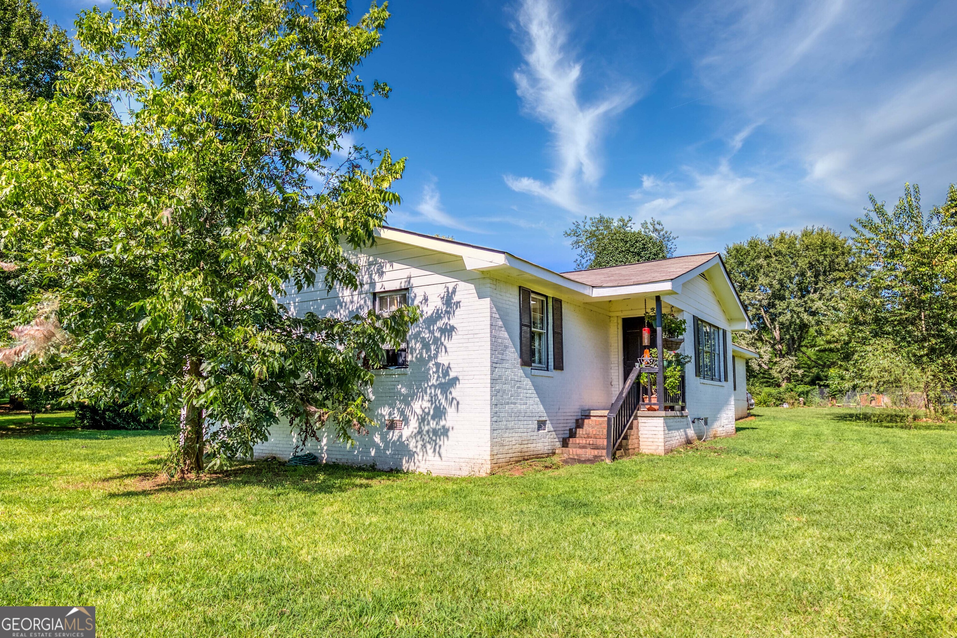 2141 Greensboro Road Madison, GA 30650 - Photo 9 of 35 a view of a house with a backyard
