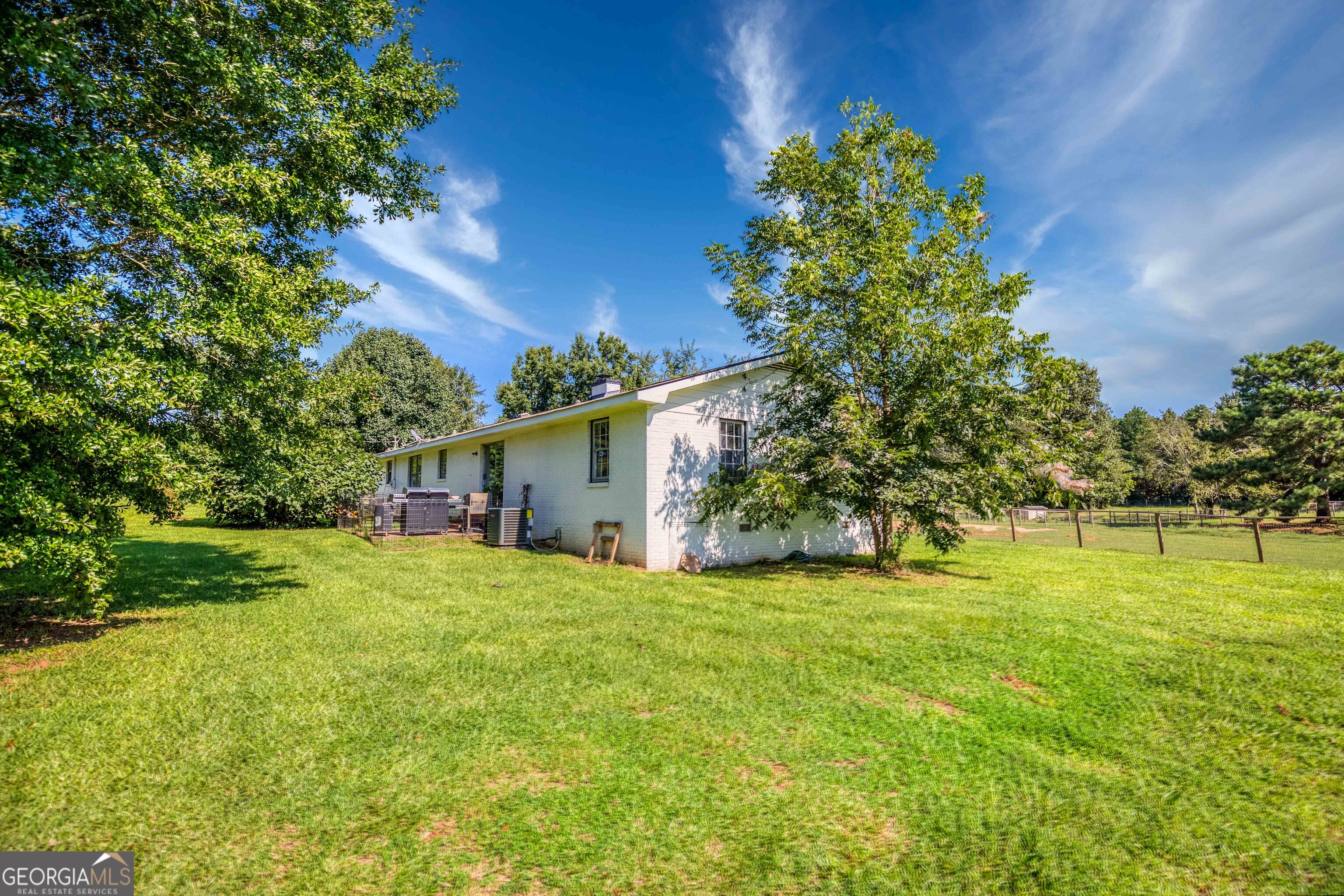 2141 Greensboro Road Madison, GA 30650 - Photo 10 of 35 a view of a house with a yard