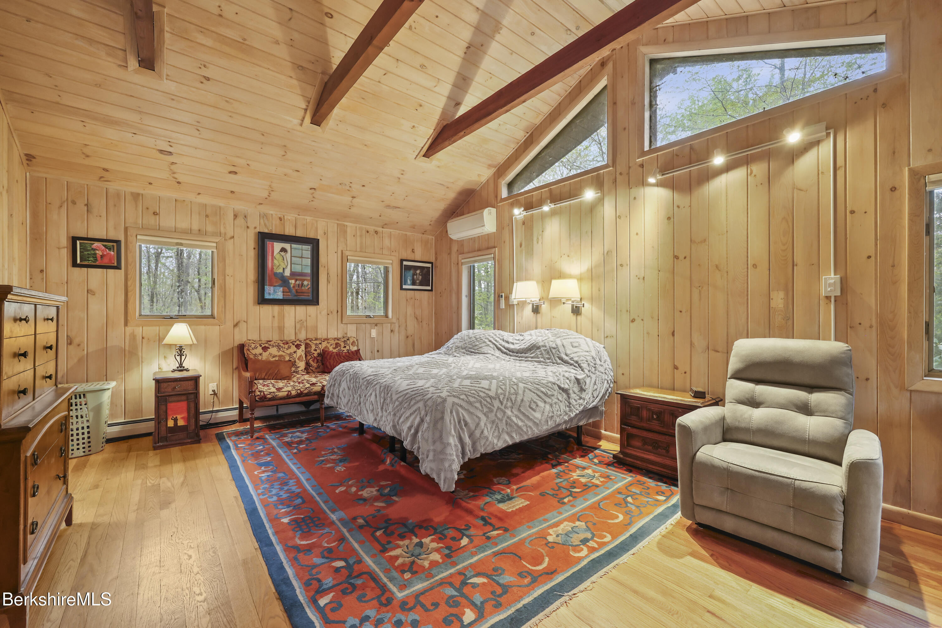 422 Bonny Rigg Hill Road Becket, MA 01223 - Photo 17 of 60 a spacious bedroom with a bed a couch and dresser
