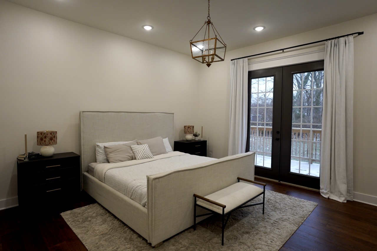 807 North Maple Street Murfreesboro, TN 37130 - Photo 10 of 16 a bedroom with a bed and wooden floor