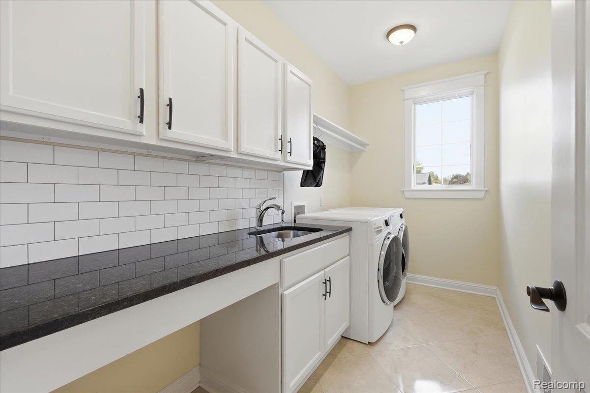 35339 West 13 Mile Road Farmington, MI 48331 - Photo 40 of 72 Laundry room featuring light tile patterned floors, washer and dryer, and cabinet space