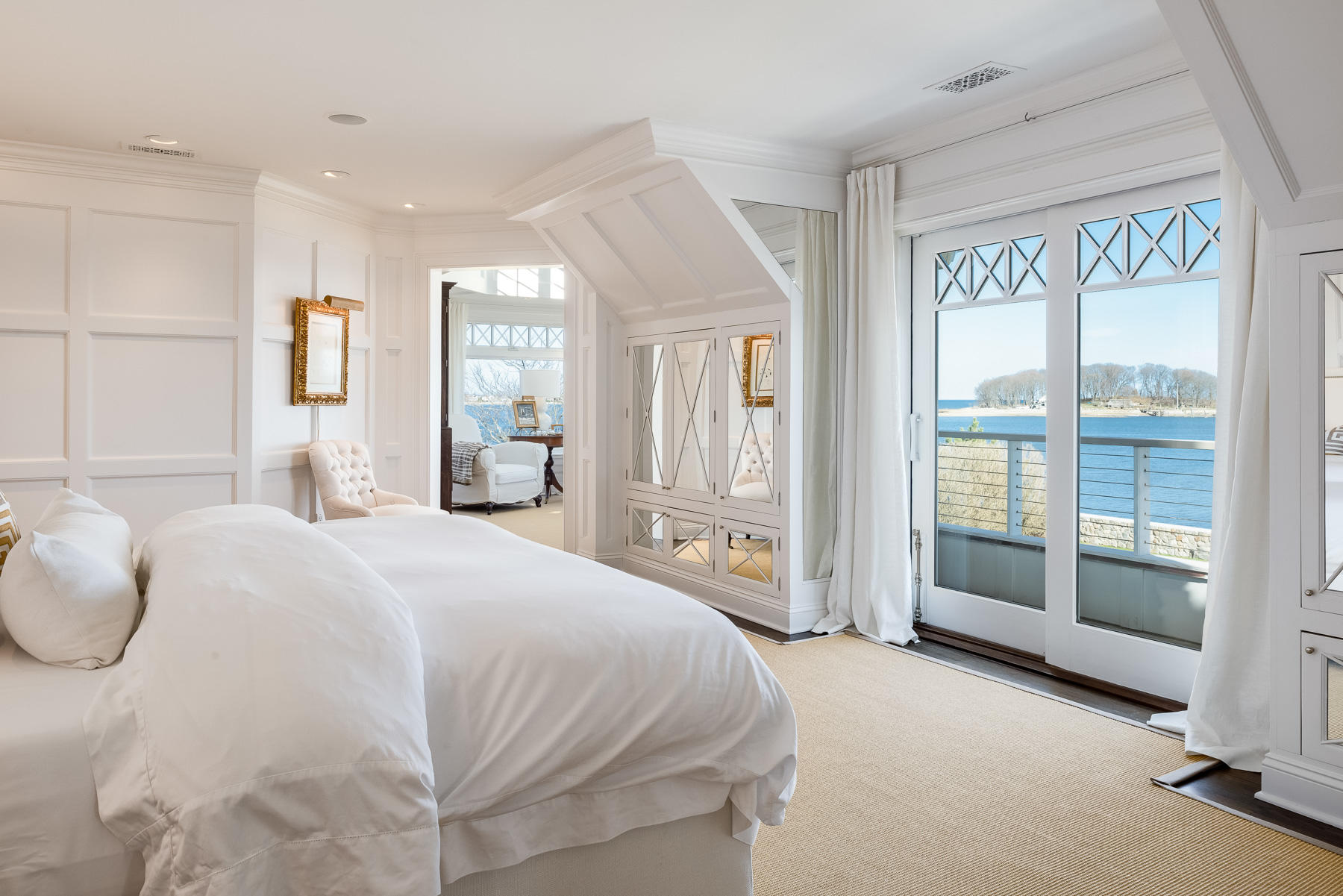 8 Shorehaven Road Norwalk, CT 06855 - Photo 15 of 27 a spacious bedroom with a bed and glass walk in closet