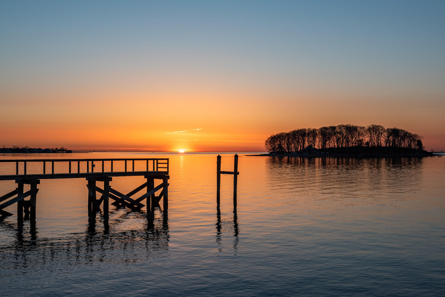 8 Shorehaven Road Norwalk, CT 06855 - Photo 25 of 27 a view of a lake with boats and trees in the background