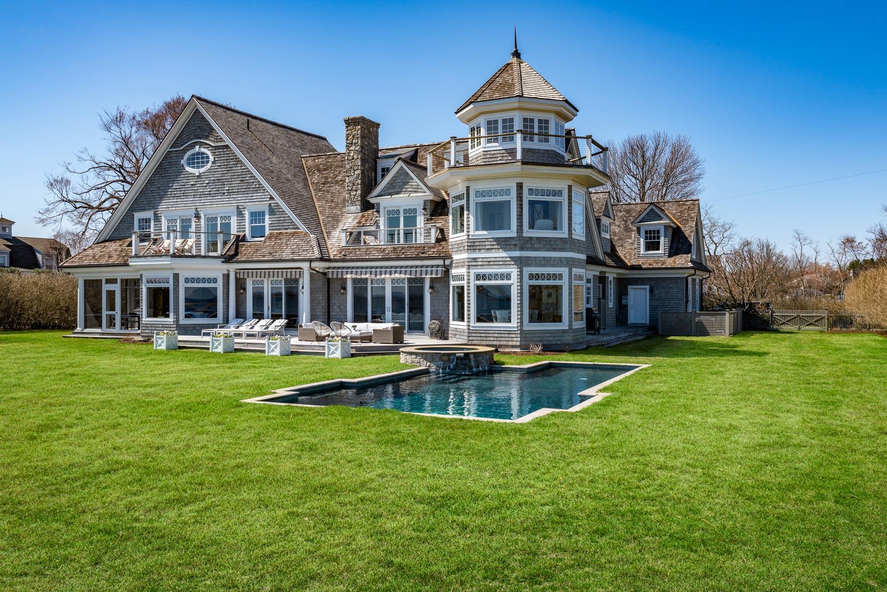 8 Shorehaven Road Norwalk, CT 06855 - Photo 4 of 27 a front view of a house with swimming pool having outdoor seating