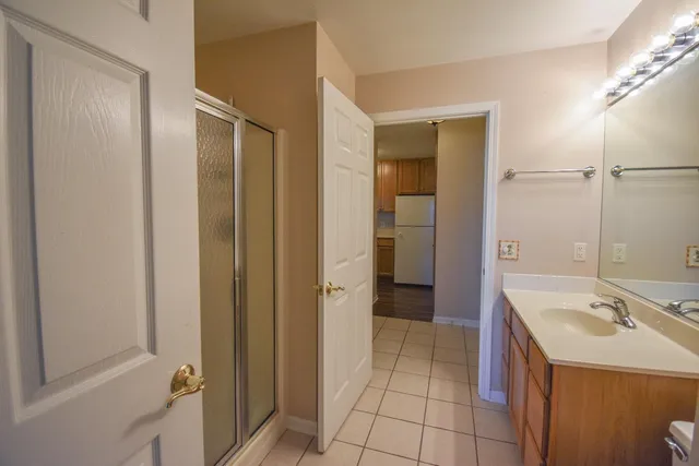 a bathroom with a sink a mirror and a bathtub