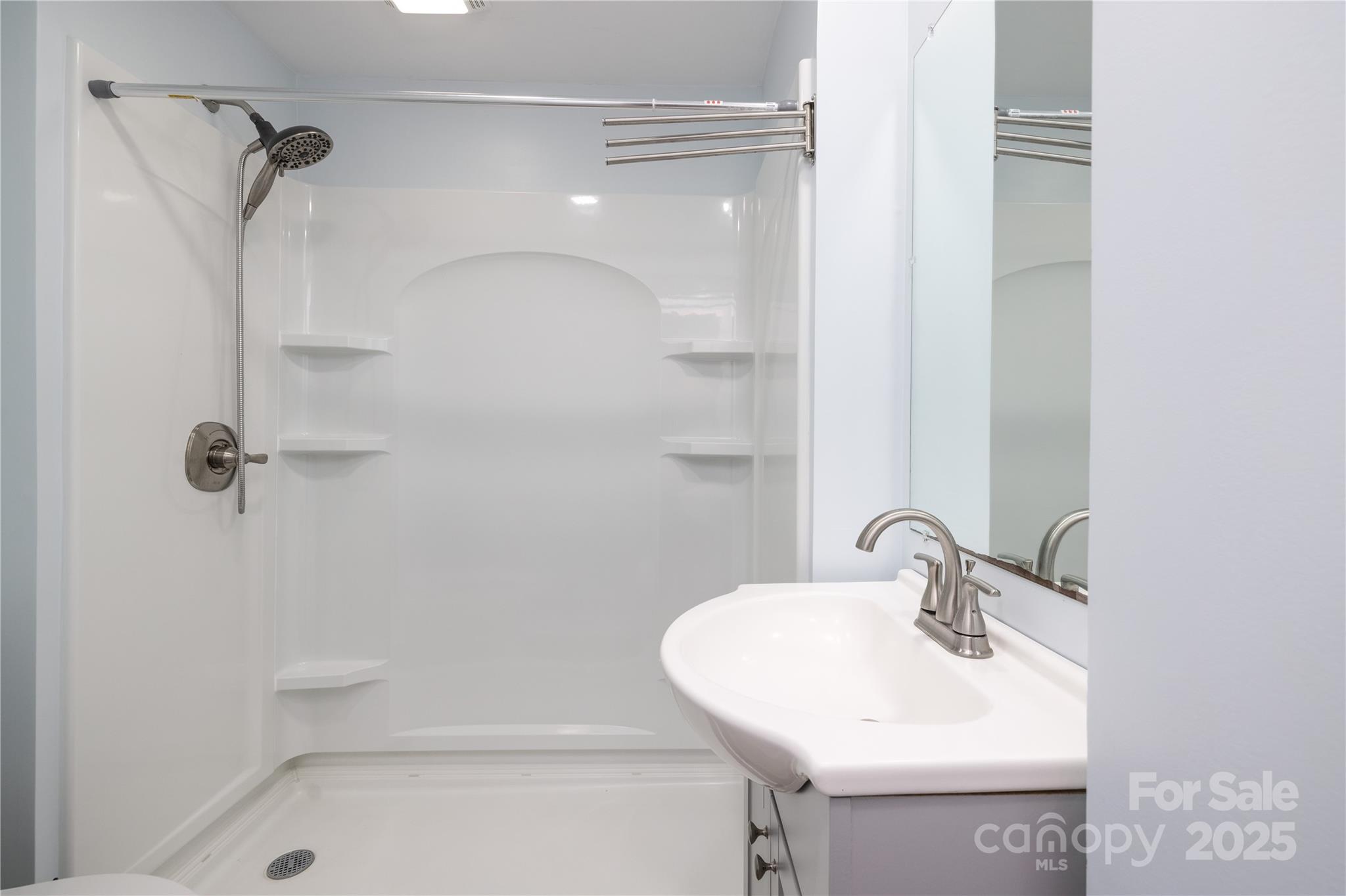 2005 Douglas Road Lancaster, SC 29720 - Photo 14 of 37 a bathroom with a sink a toilet and shower