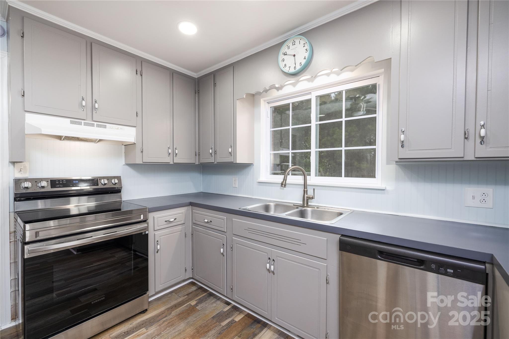 2005 Douglas Road Lancaster, SC 29720 - Photo 17 of 37 a kitchen with a sink stove and cabinets