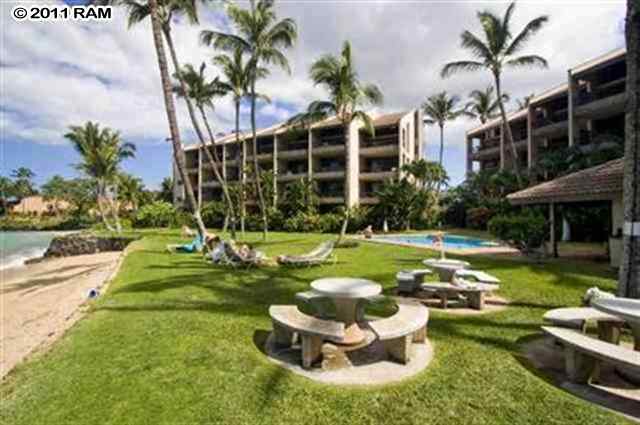 3875 Lower Honoapiilani Road, Unit B204 Lahaina, HI 96761 - Photo 3 of 4 a swimming pool with barbeque oven outdoor seating and yard