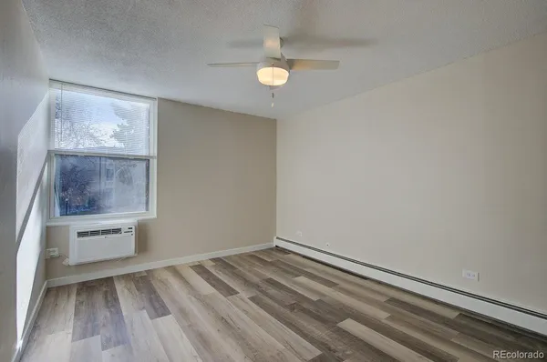 a view of a room with wooden floor and staircase