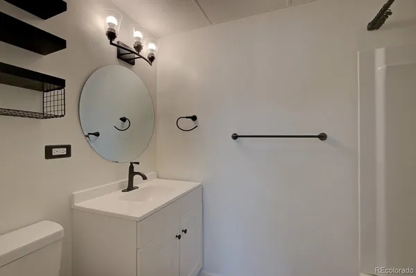 a bathroom with a sink and mirror