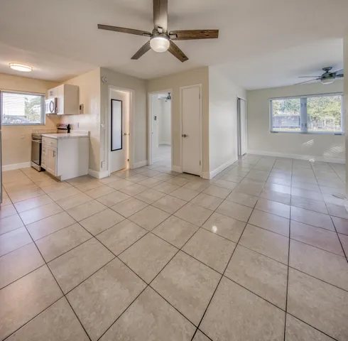 a view of a livingroom with a furniture cabinets and window