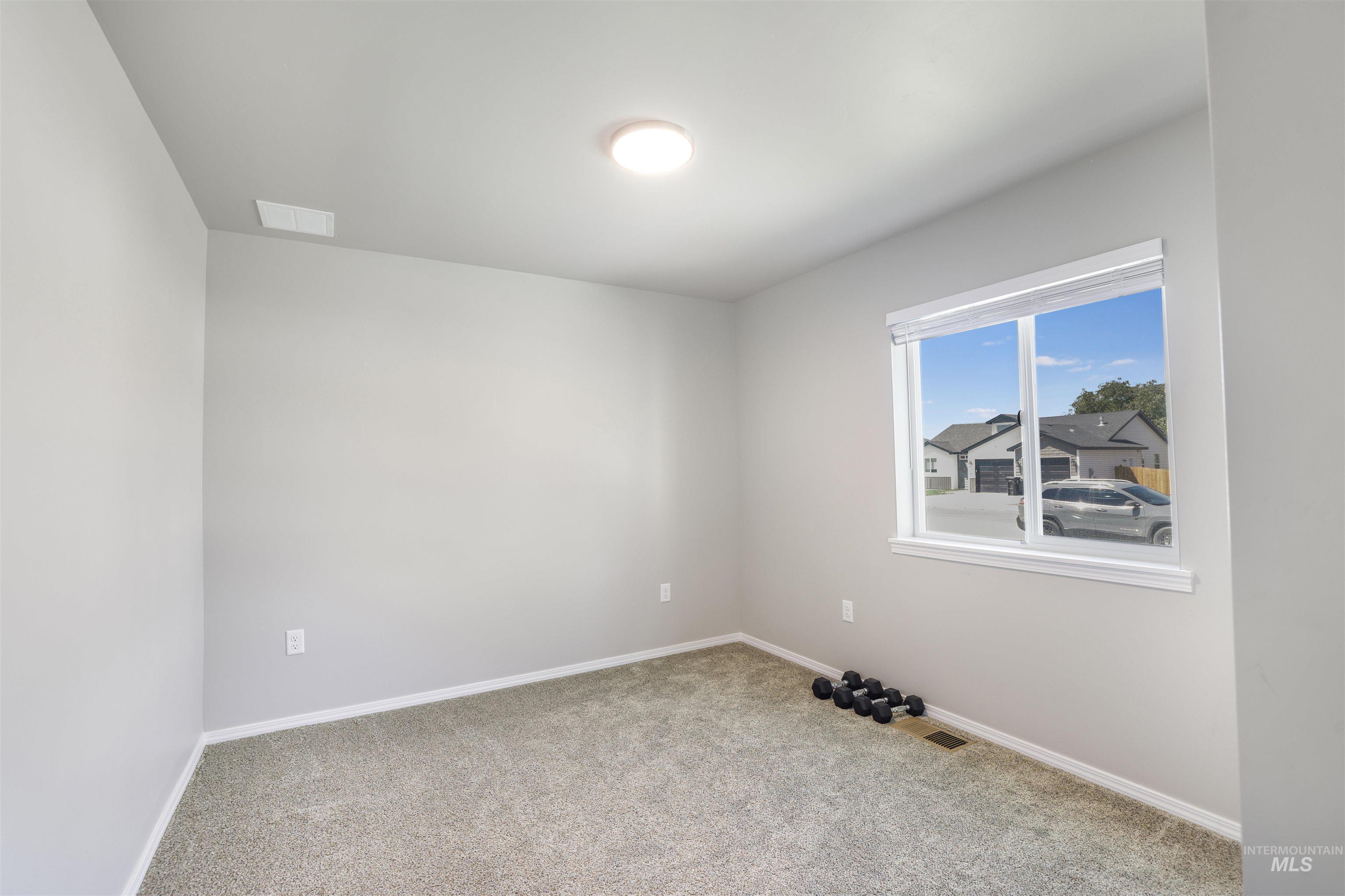 1113 Meadow Lake Loop Buhl, ID 83316 - Photo 11 of 15 Carpeted empty room with baseboards