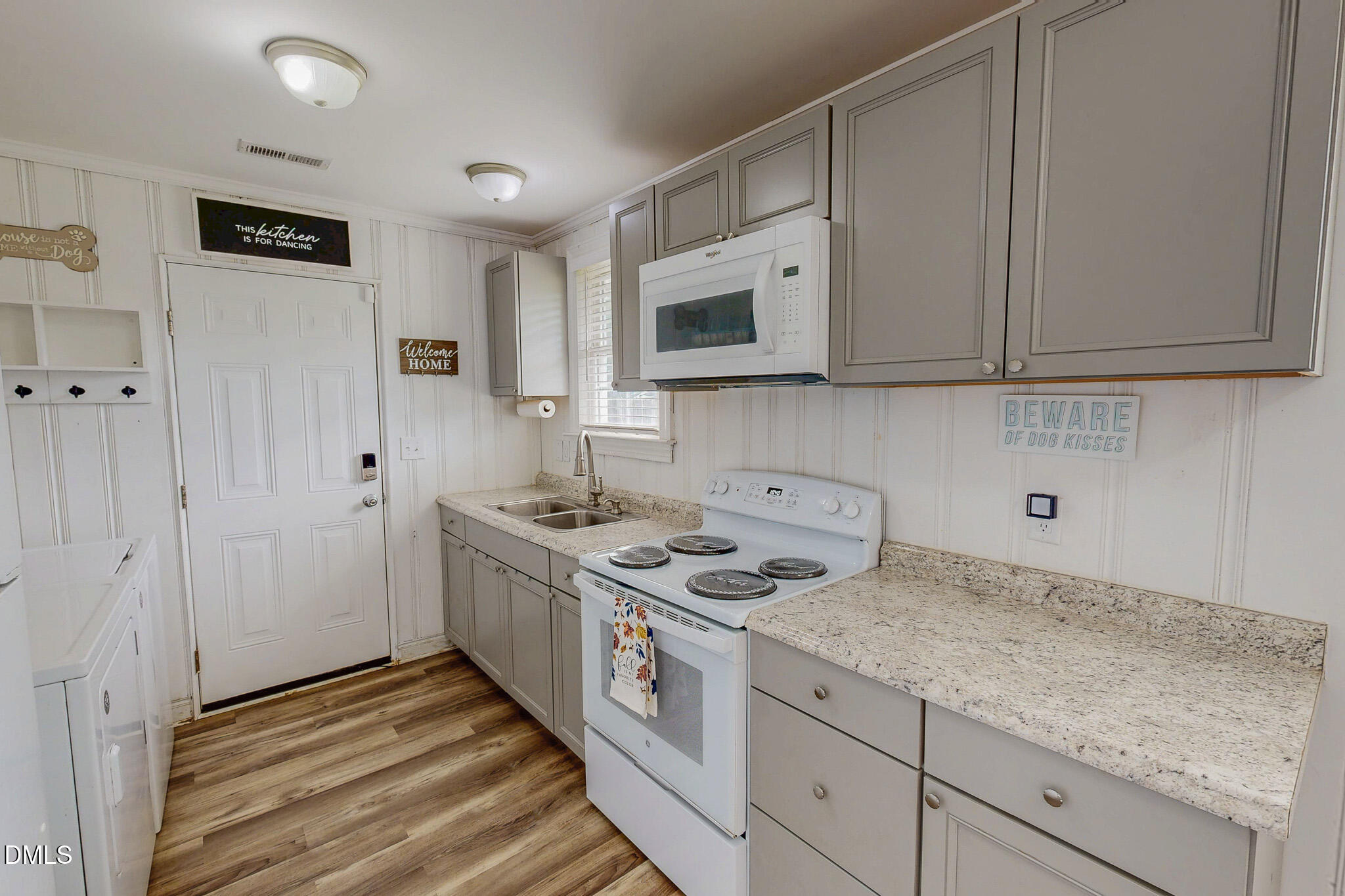 1249 Pointer Street Roxboro, NC 27573 - Photo 13 of 22 a kitchen with stainless steel appliances granite countertop a stove a sink and a white cabinets