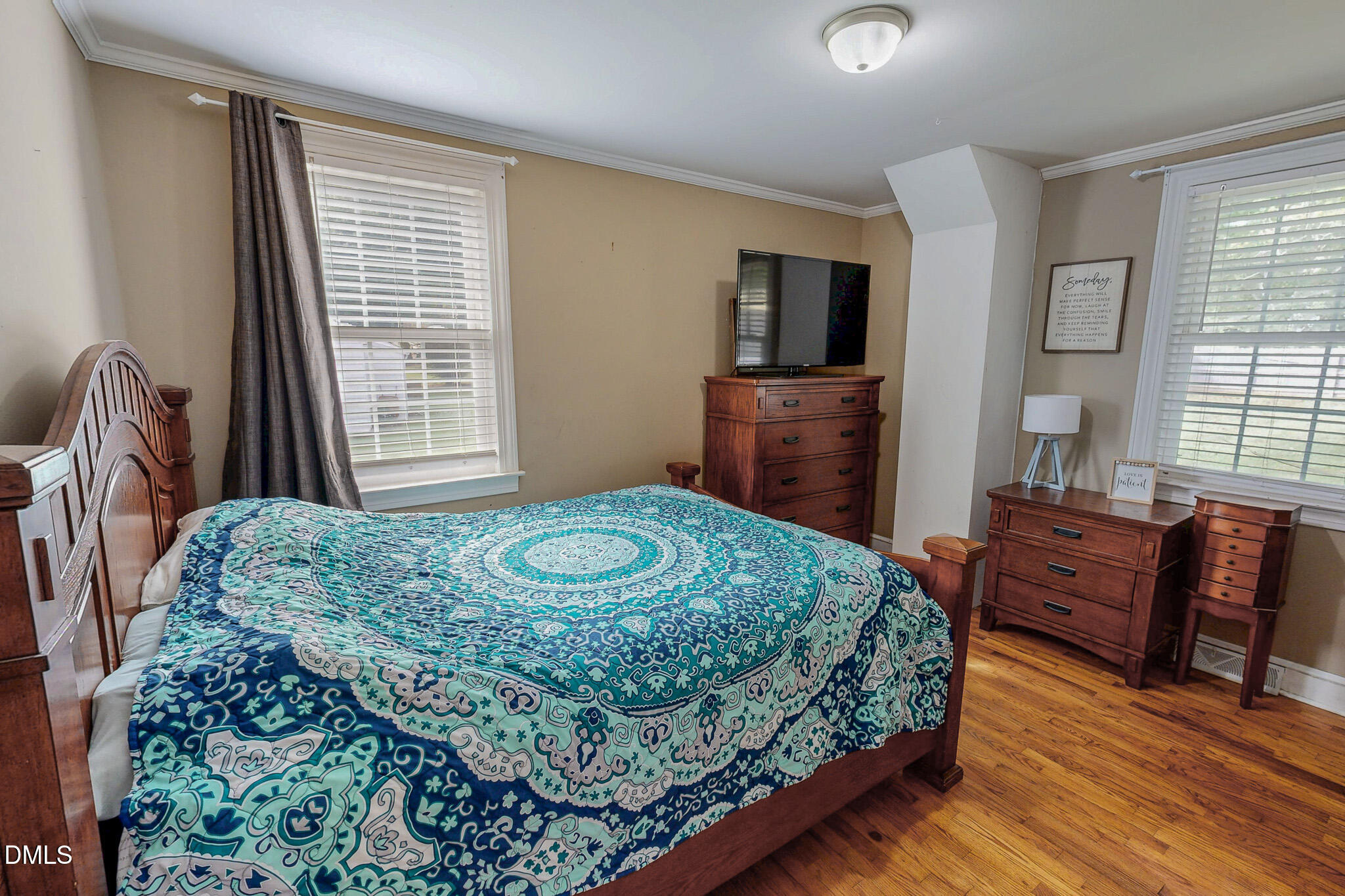 1249 Pointer Street Roxboro, NC 27573 - Photo 18 of 22 a bedroom with a bed and wooden floor