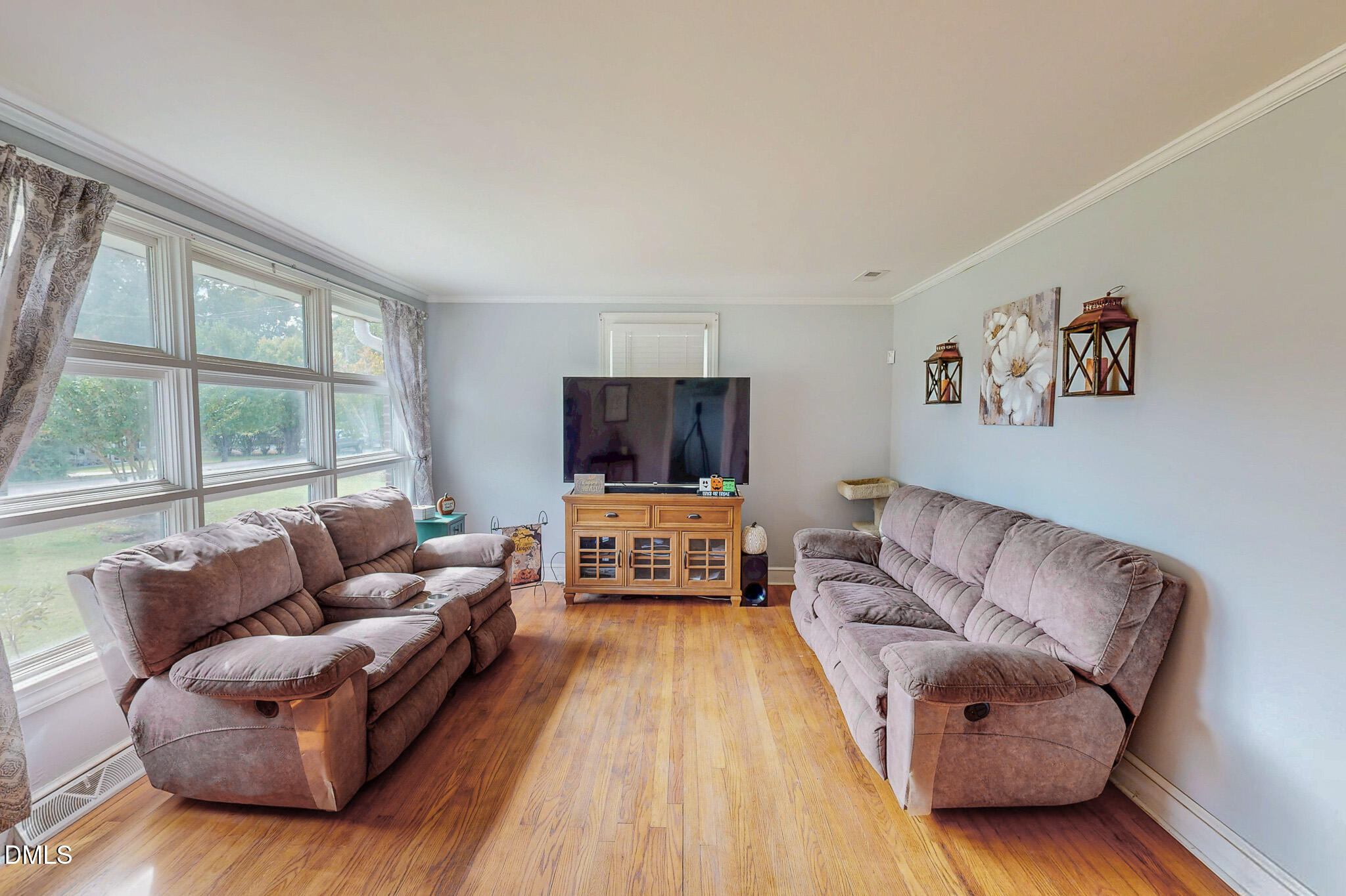 1249 Pointer Street Roxboro, NC 27573 - Photo 3 of 22 a living room with furniture and a flat screen tv