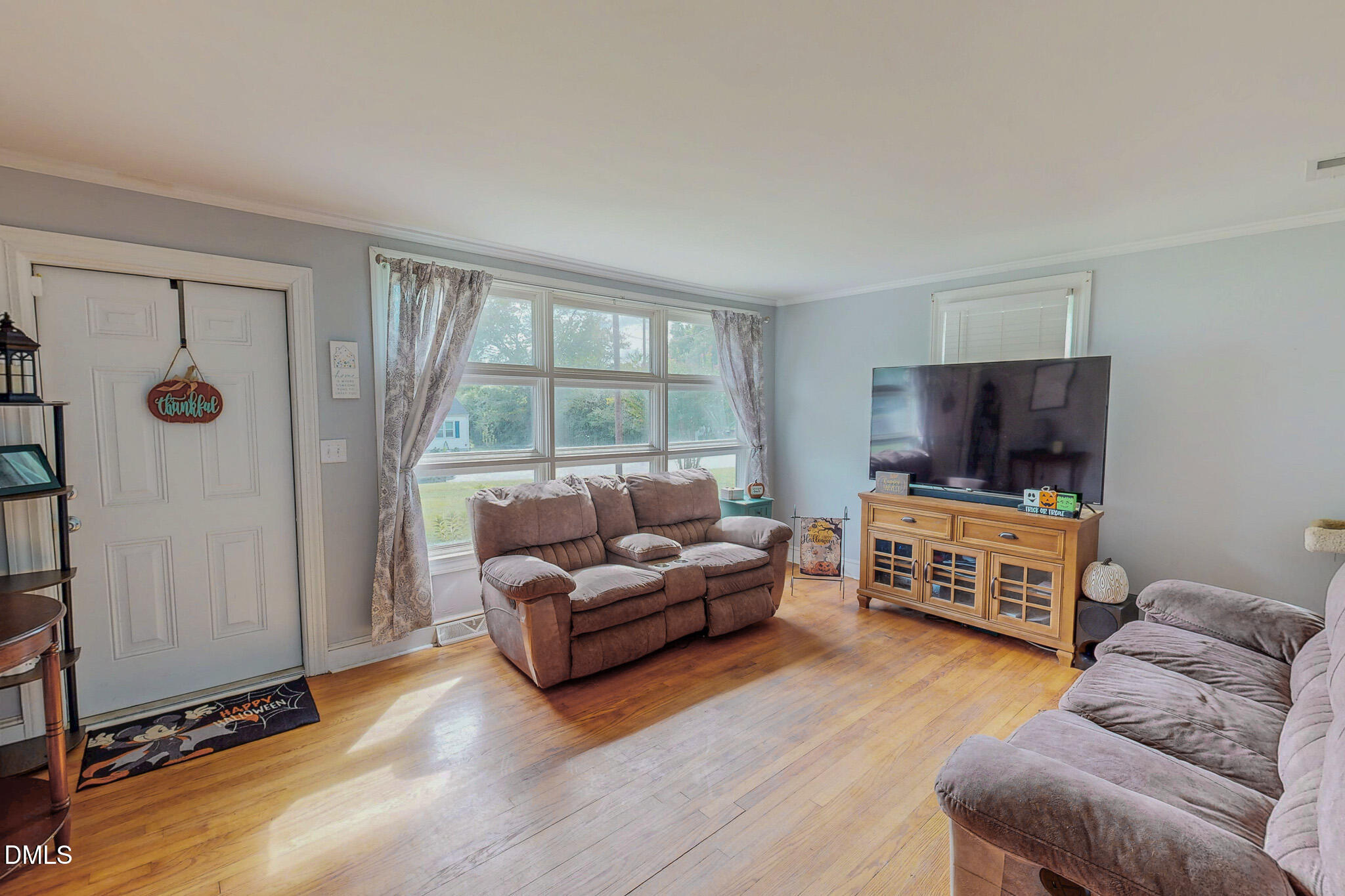 1249 Pointer Street Roxboro, NC 27573 - Photo 9 of 22 a living room with furniture and a flat screen tv