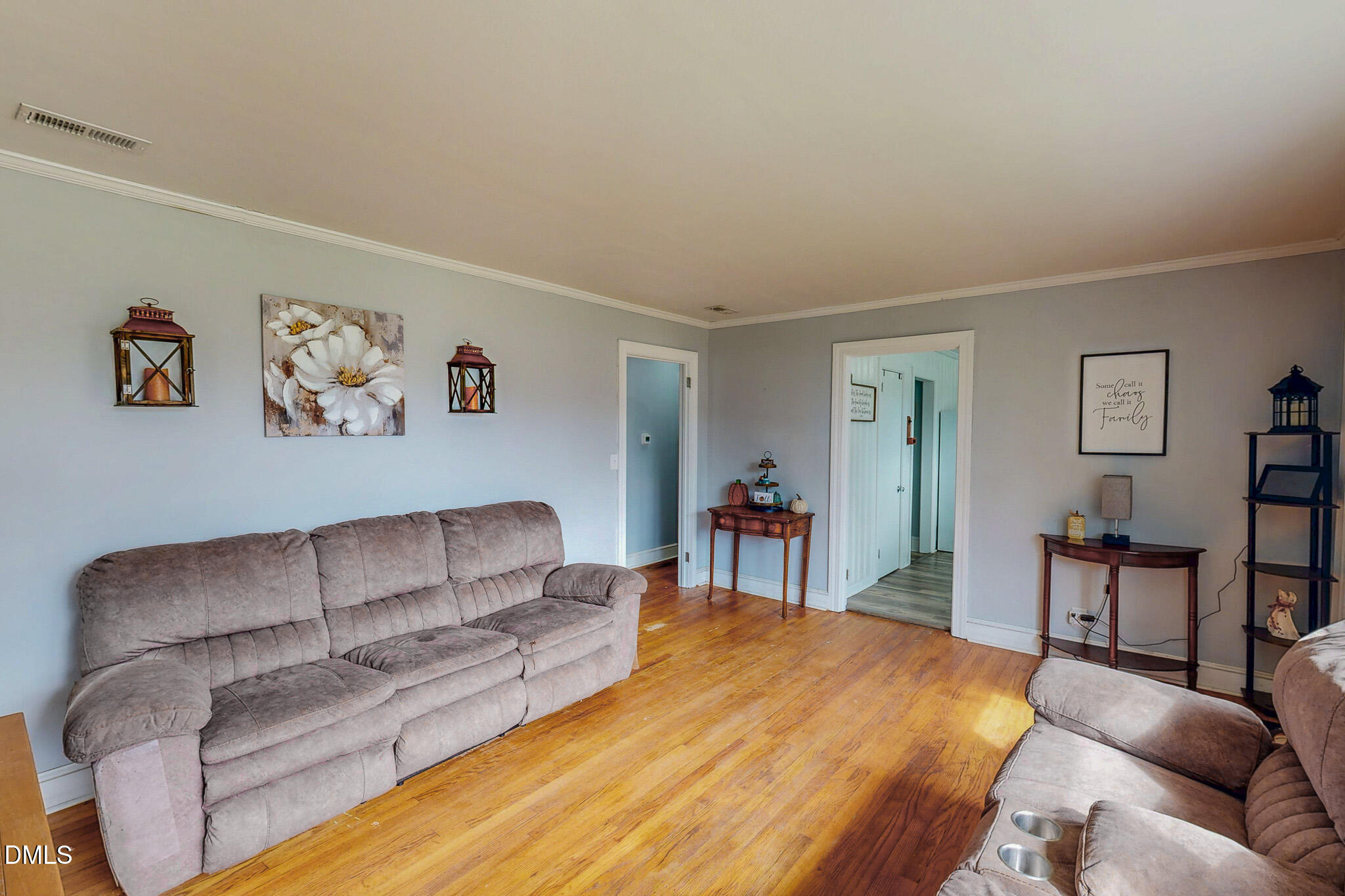 1249 Pointer Street Roxboro, NC 27573 - Photo 10 of 22 a living room with furniture and a dining table with bookshelf