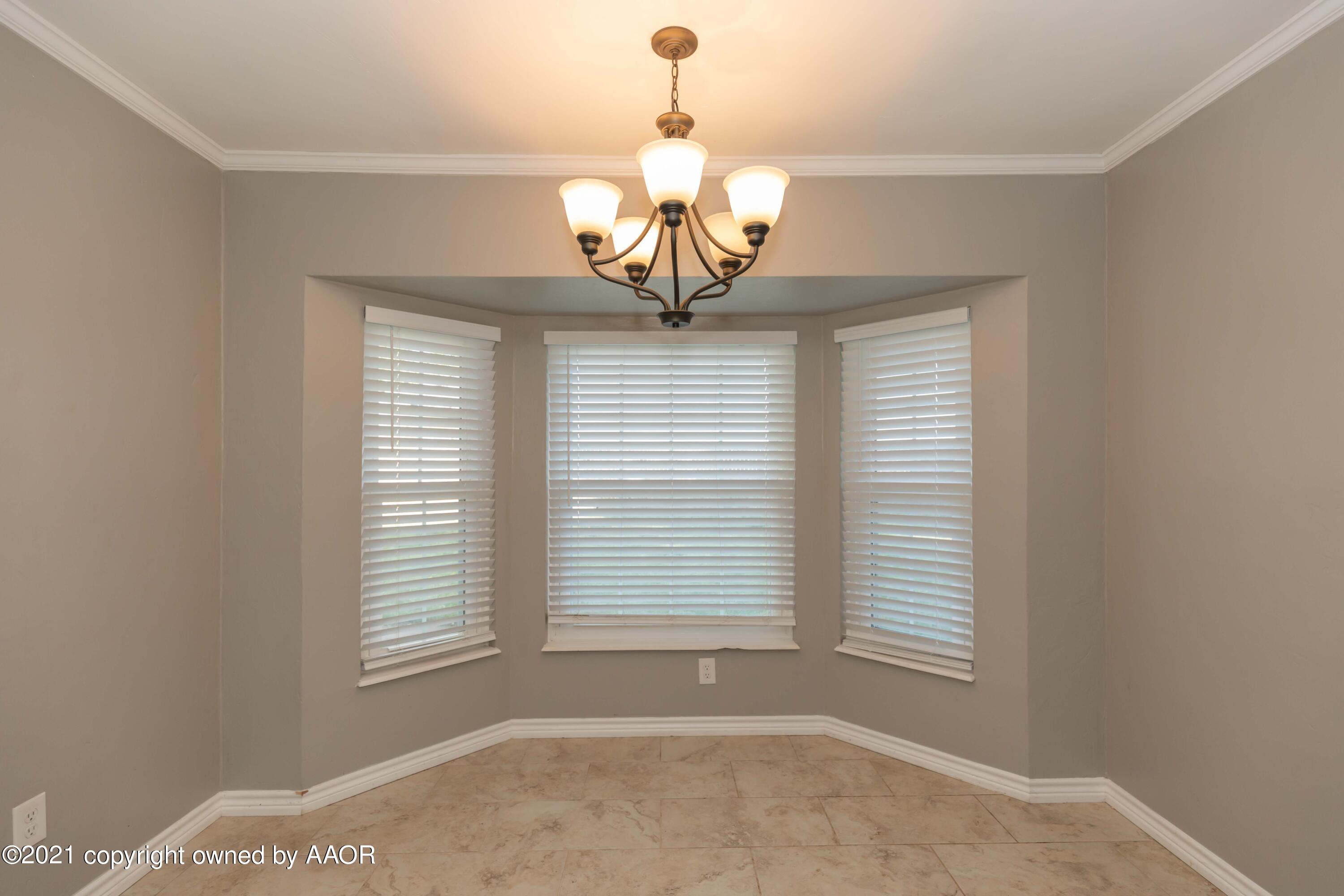 5142 McCarty Boulevard Amarillo, TX 79110 - Photo 15 of 38 a view of a chandelier in a room