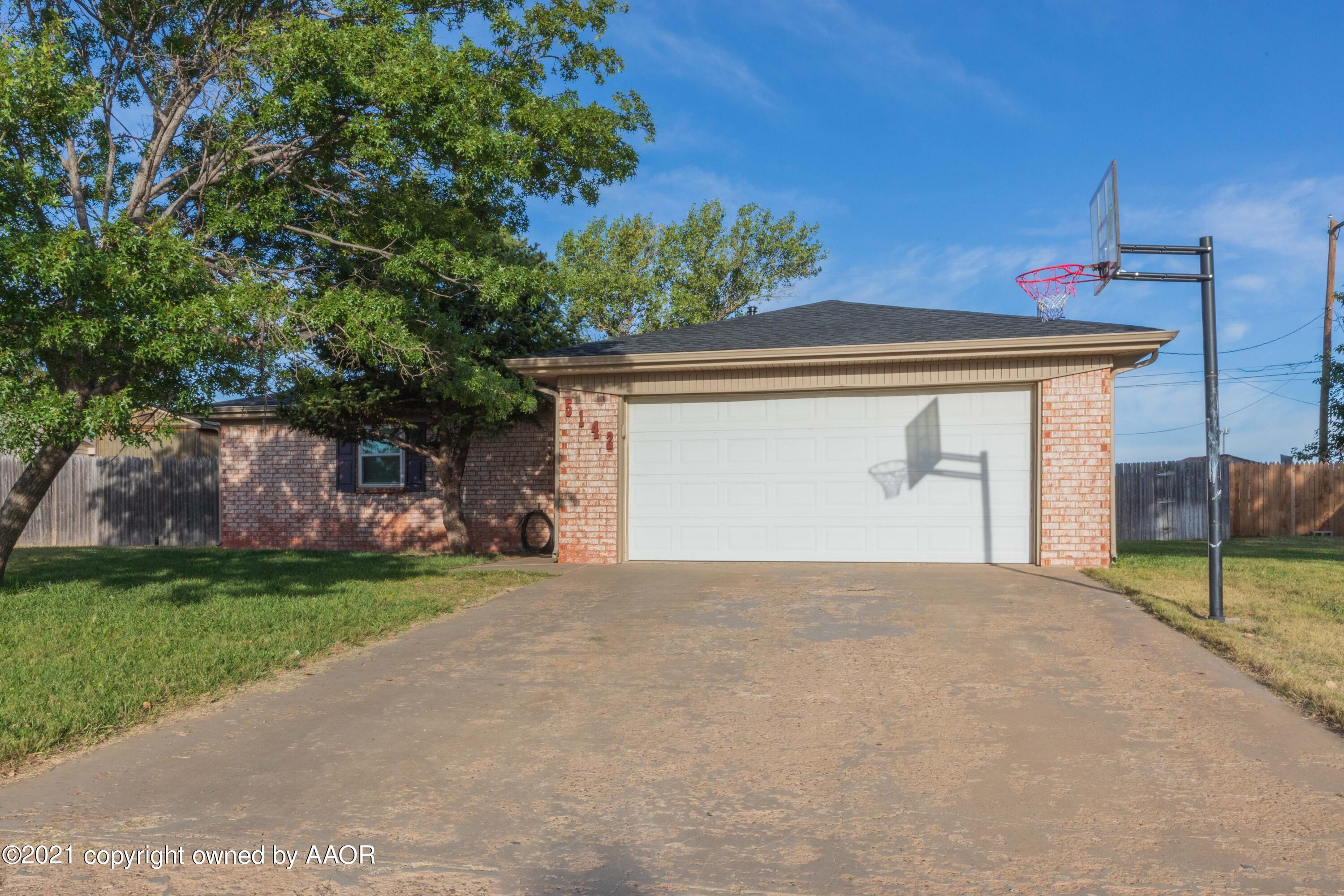 5142 McCarty Boulevard Amarillo, TX 79110 - Photo 2 of 38 a view of a house with a yard and potted plants