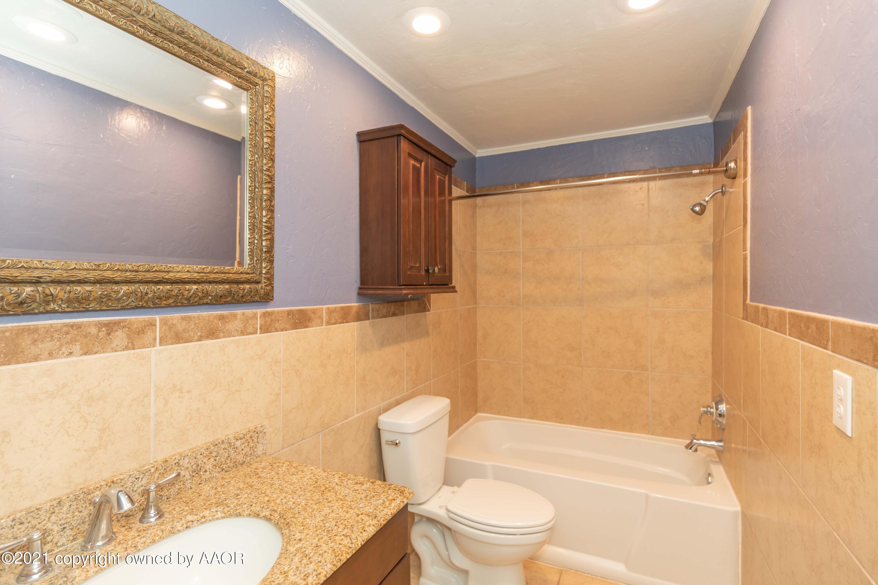 5142 McCarty Boulevard Amarillo, TX 79110 - Photo 27 of 38 a bathroom with a sink toilet and shower
