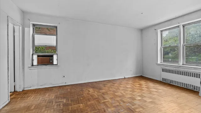 a view of an empty room with a window
