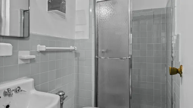 a bathroom with a sink and shower