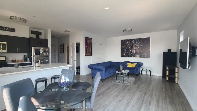 a view of a dining room with furniture and wooden floor