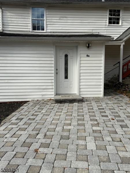 a side view of a house with a white door