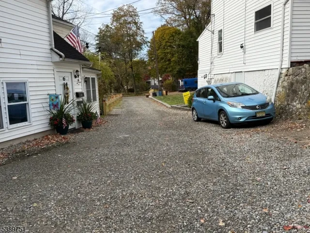 a view of a car park in front of house