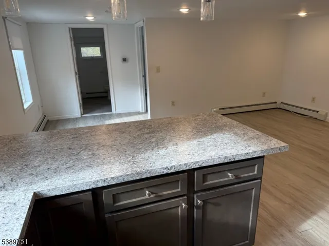 a view of a microwave and cabinets