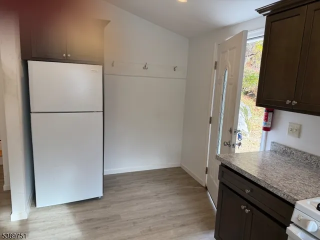 a kitchen with a sink a refrigerator and a stove