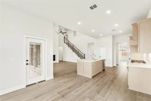 a view of kitchen with furniture and wooden floor