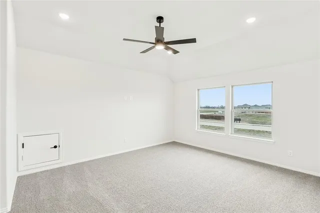 an empty room with a empty space and windows