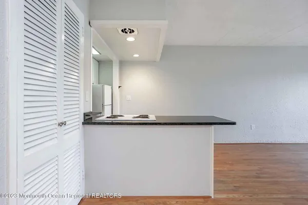 a view of a hallway with seating area