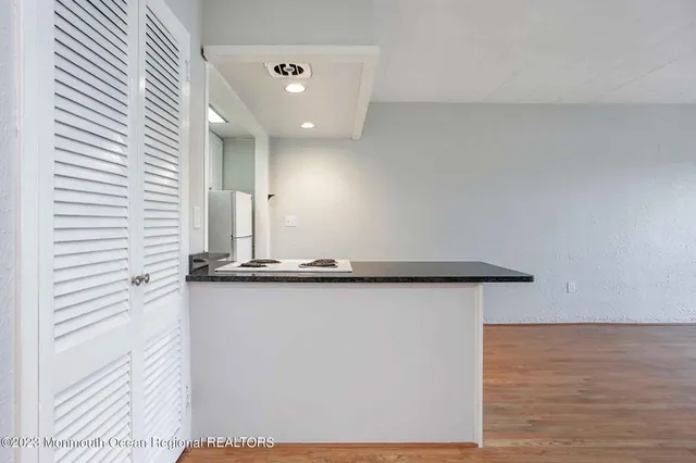 a view of a hallway with seating area