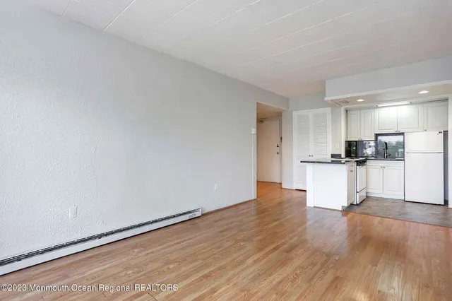 a view of kitchen with wooden floor