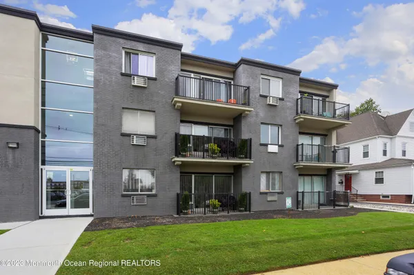 a view of a building with a yard