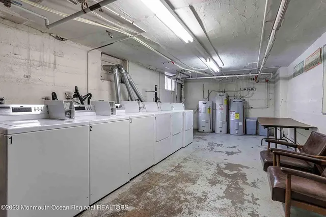 a utility room with sink dryer and washer
