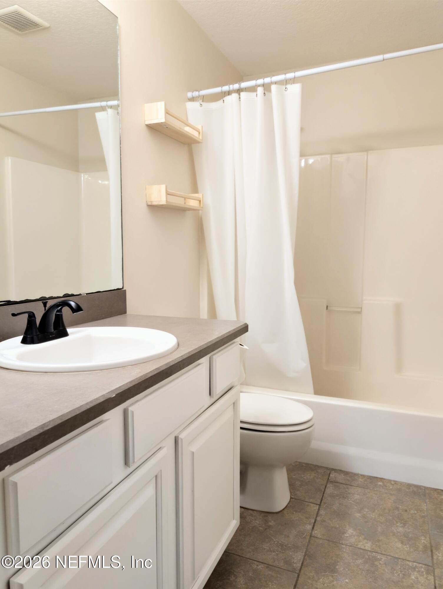 7 Arthur Street St. Augustine, FL 32084 - Photo 19 of 30 a bathroom with a sink a toilet and shower