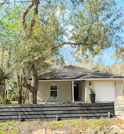 a front view of small house with yard