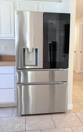a refrigerator freezer sitting in a kitchen