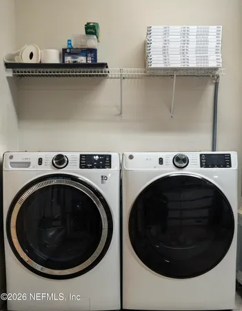 a utility room with dryer and washer