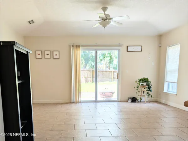 a view of an empty room with a window