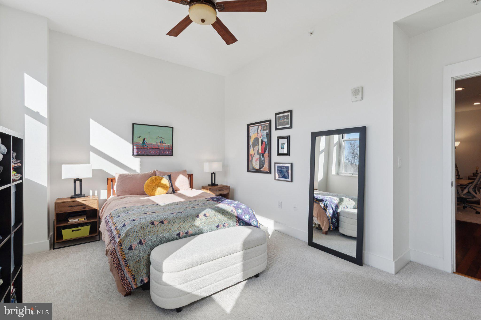 1101 Locust Street, Unit 3C Philadelphia, PA 19107 - Photo 14 of 28 a bedroom with a bed and a mirror
