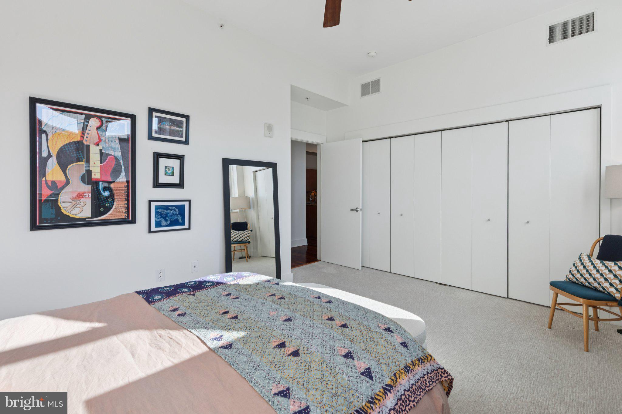 1101 Locust Street, Unit 3C Philadelphia, PA 19107 - Photo 16 of 28 a bedroom with a bed and a couch