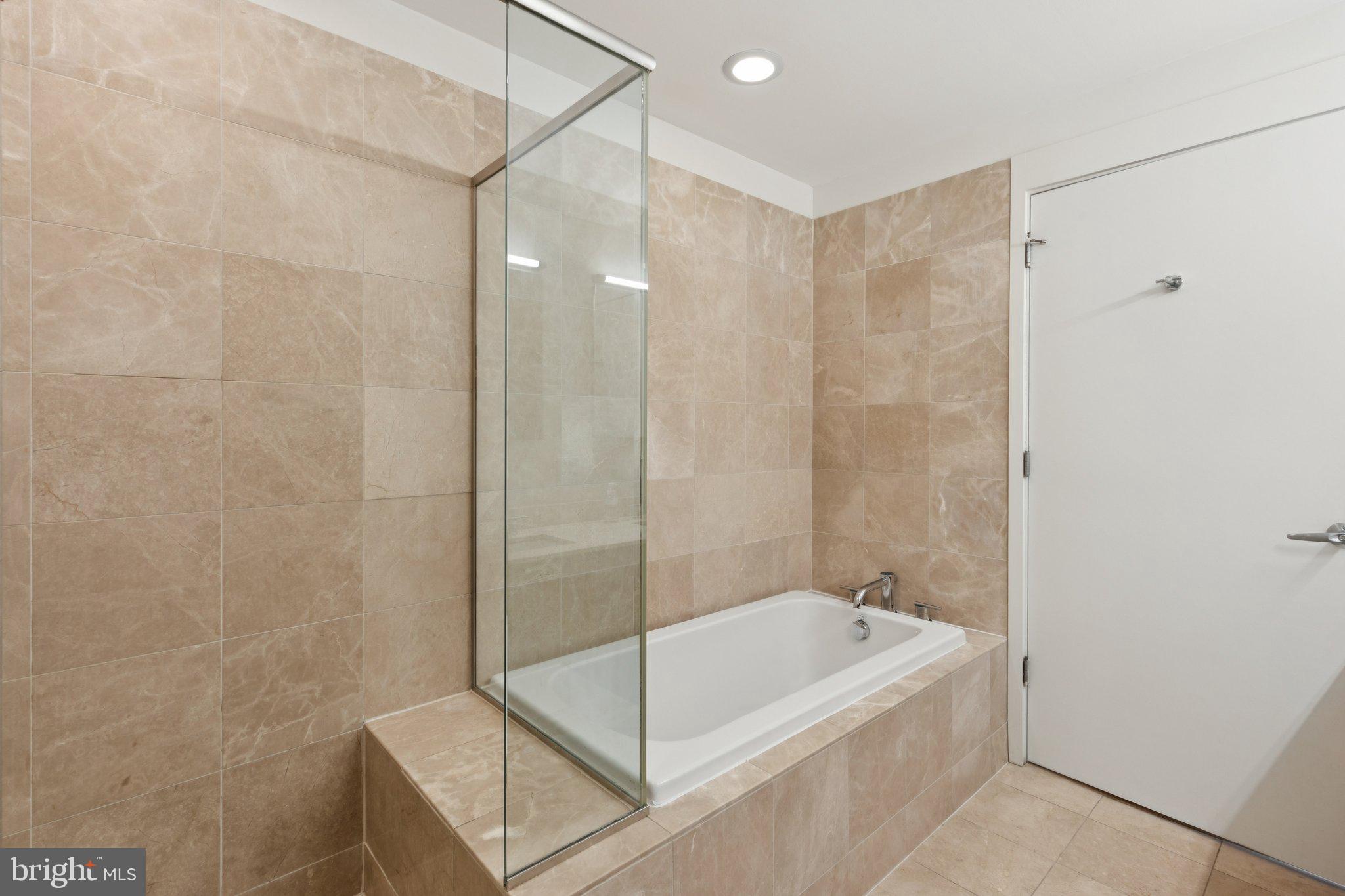 1101 Locust Street, Unit 3C Philadelphia, PA 19107 - Photo 21 of 28 a bathroom with a tub and shower