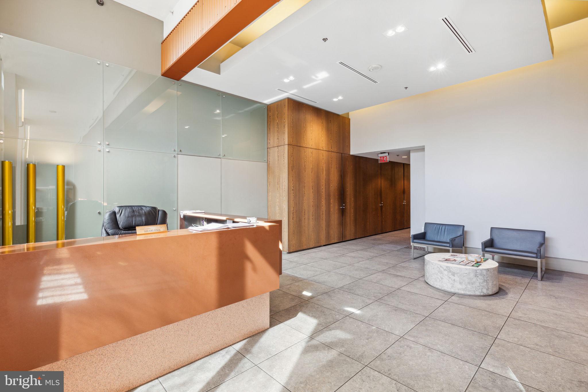 1101 Locust Street, Unit 3C Philadelphia, PA 19107 - Photo 22 of 28 a large bathroom with a large mirror vanity and toilet