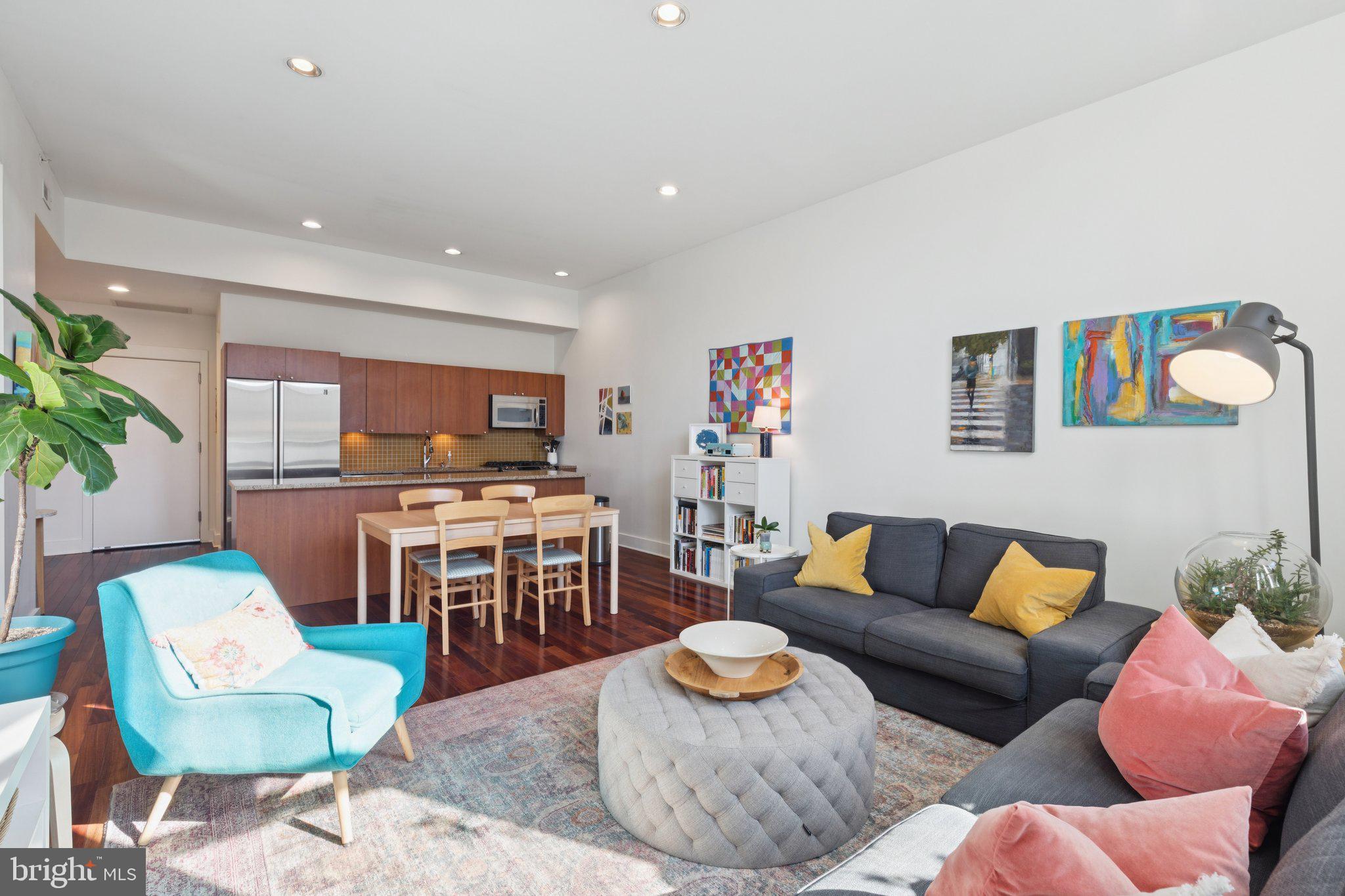 1101 Locust Street, Unit 3C Philadelphia, PA 19107 - Photo 3 of 28 a living room with furniture kitchen view and a table