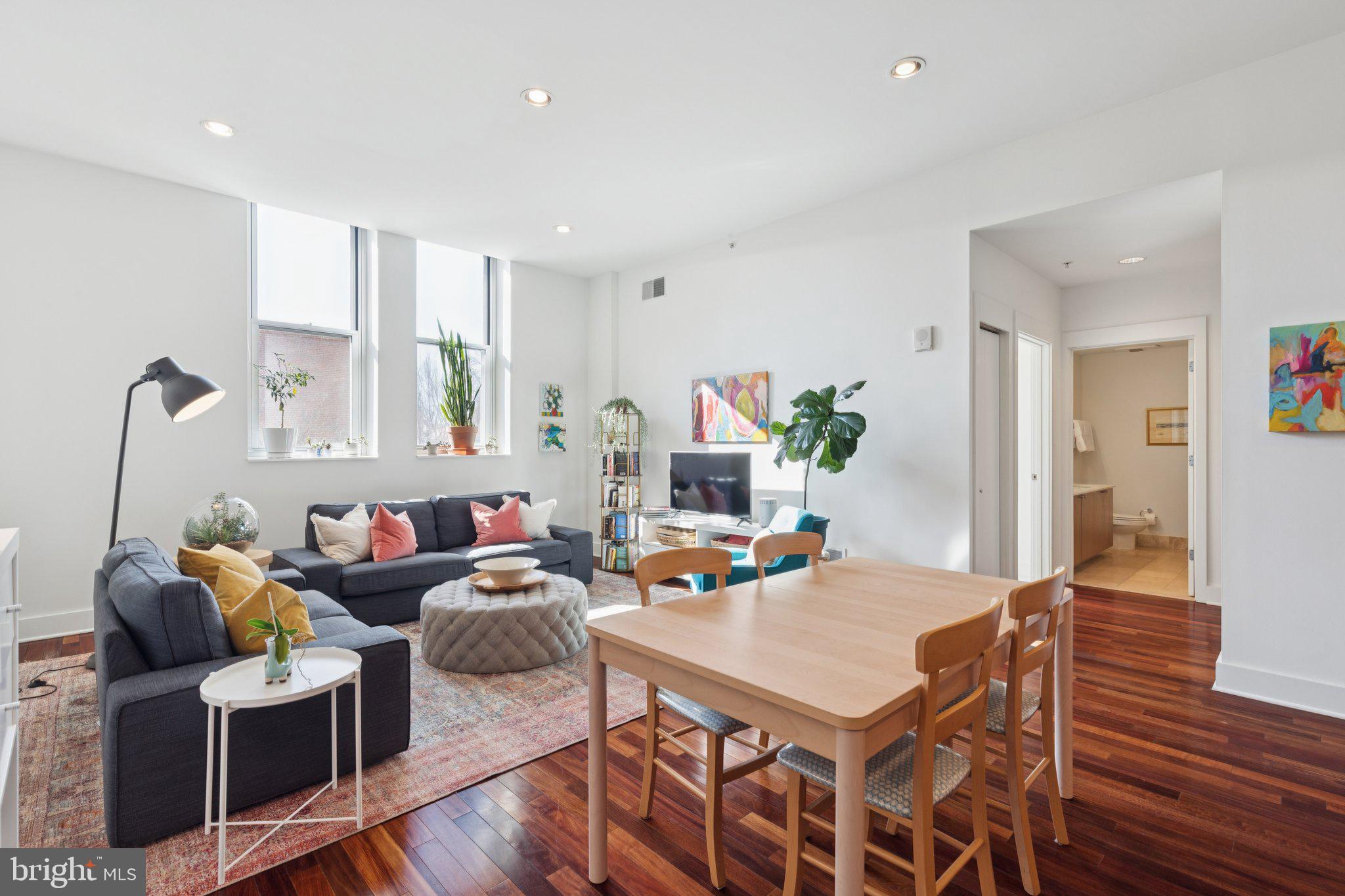 1101 Locust Street, Unit 3C Philadelphia, PA 19107 - Photo 5 of 28 a living room with furniture and wooden floor