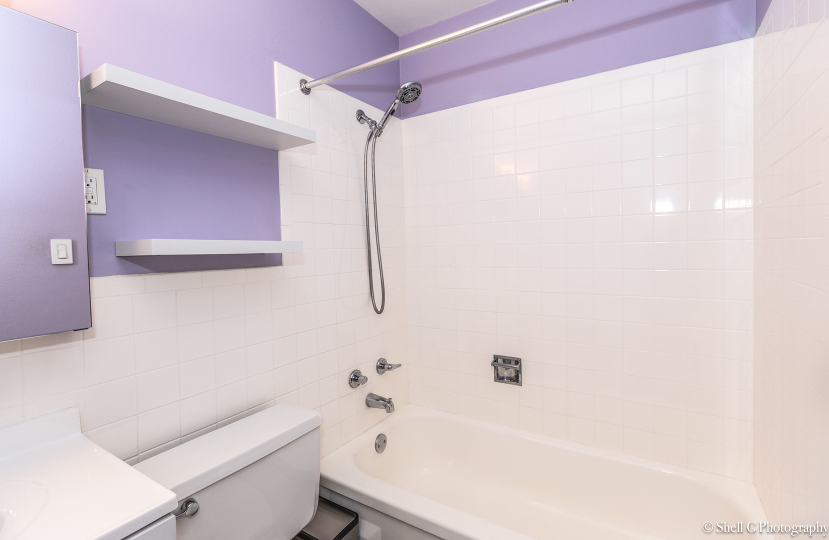 9745 Karlov Avenue, Unit 607 Oak Lawn, IL 60453 - Photo 11 of 16 a bathroom with a sink a toilet and shower